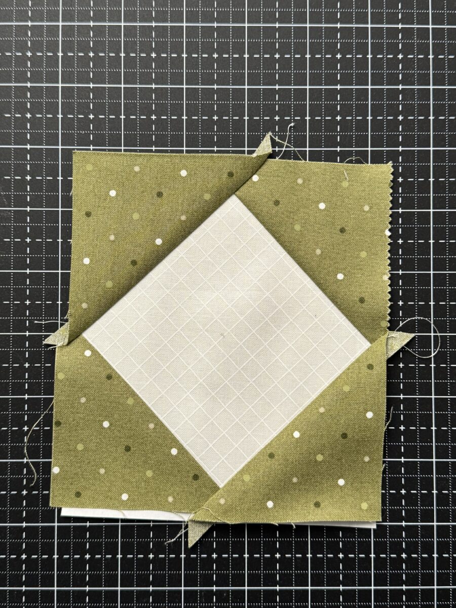 Final fabric section sewn onto foundation paper pieced flying geese block