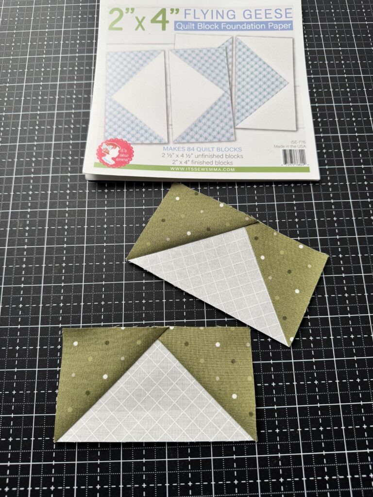 Two completed flying geese quilt units made using foundation paper piecing with crisp points and accurate seams