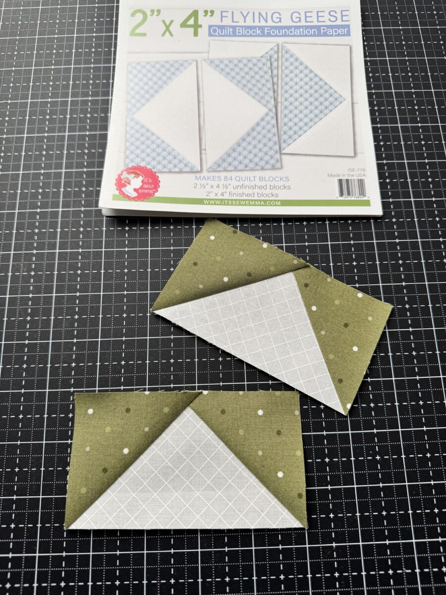 Two completed flying geese quilt units made using foundation paper piecing with crisp points and accurate seams