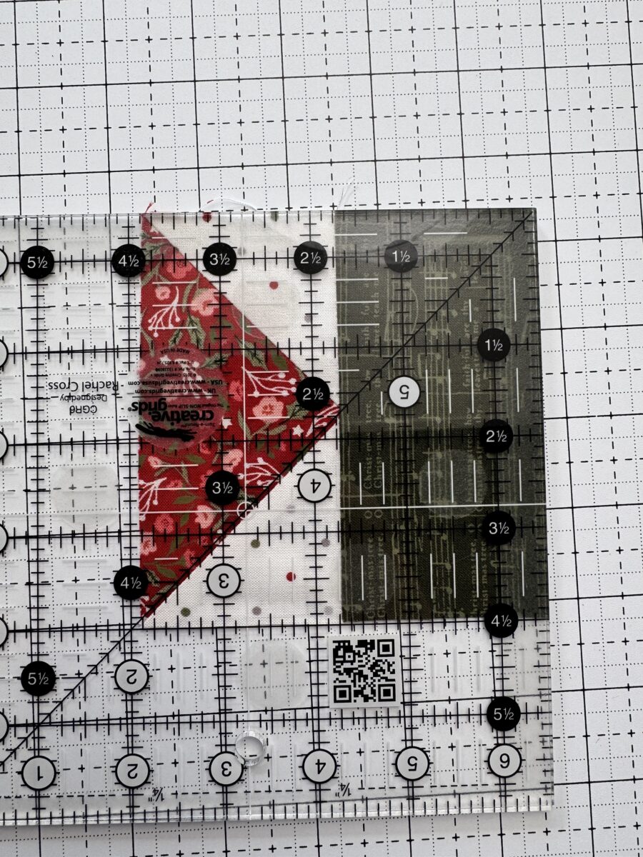 Quilting ruler showing a flying geese unit that measures too small because the seam allowance was too large