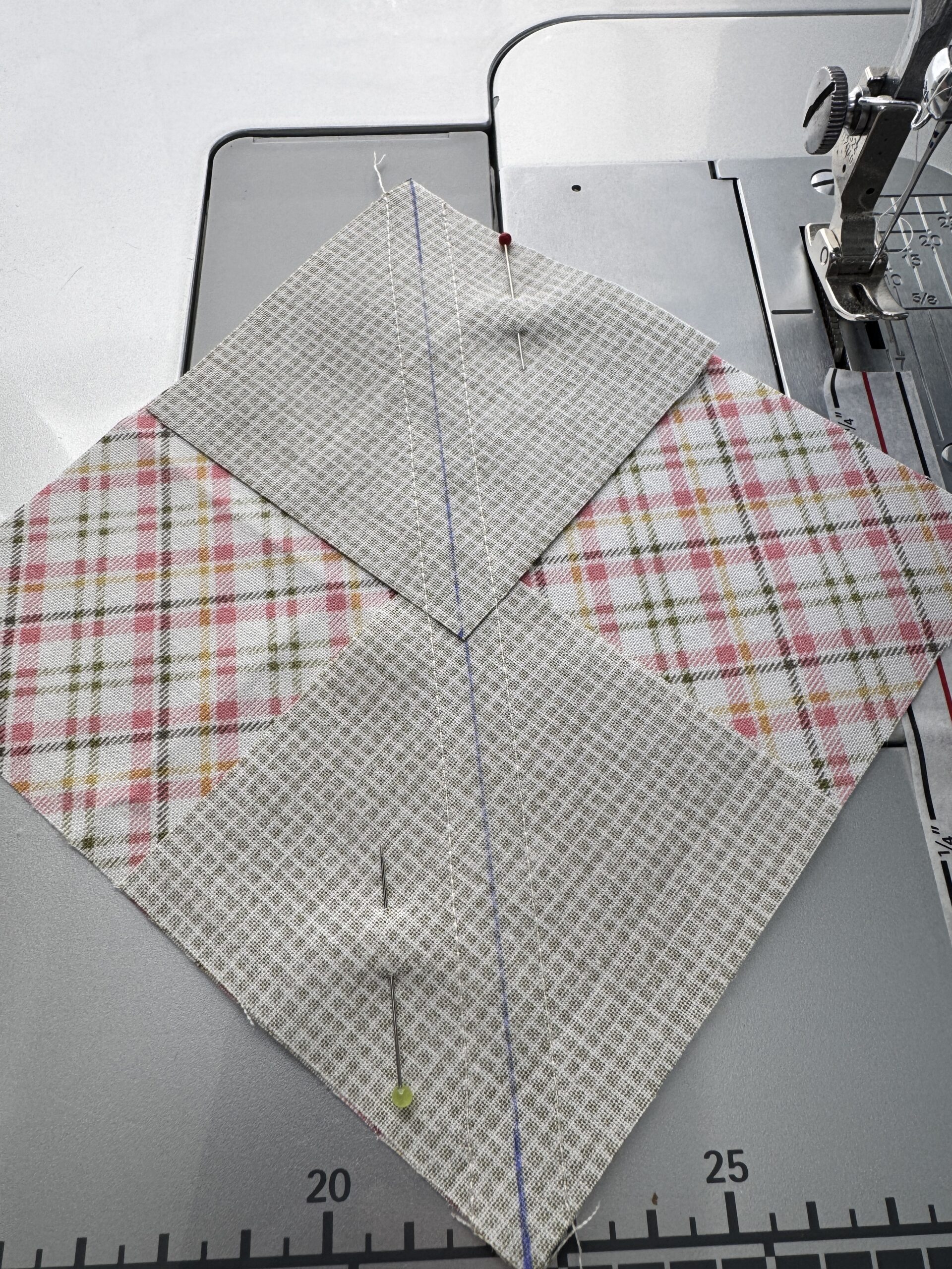 Alt Text: marking diagonal lines and sewing no waste flying geese step one