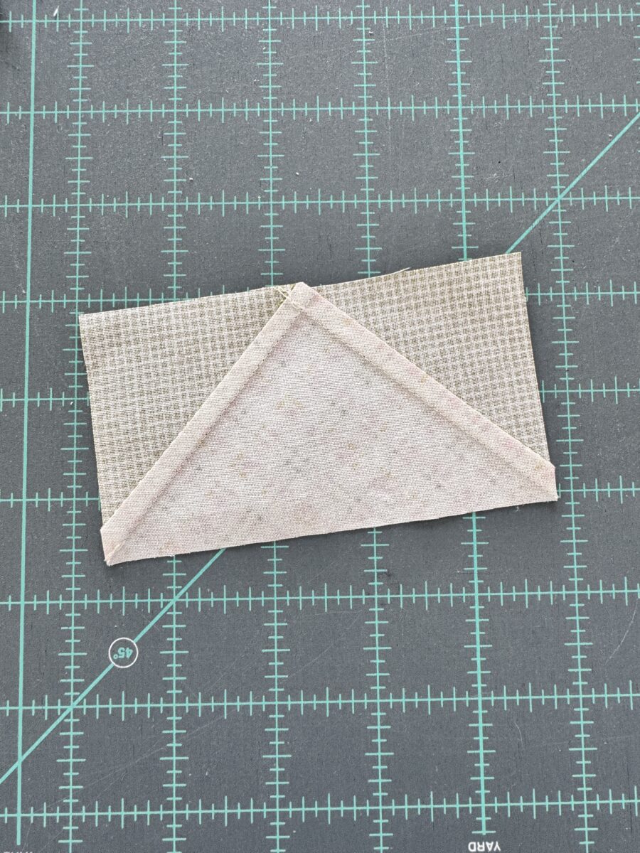 back of flying geese quilt block showing pressed seams