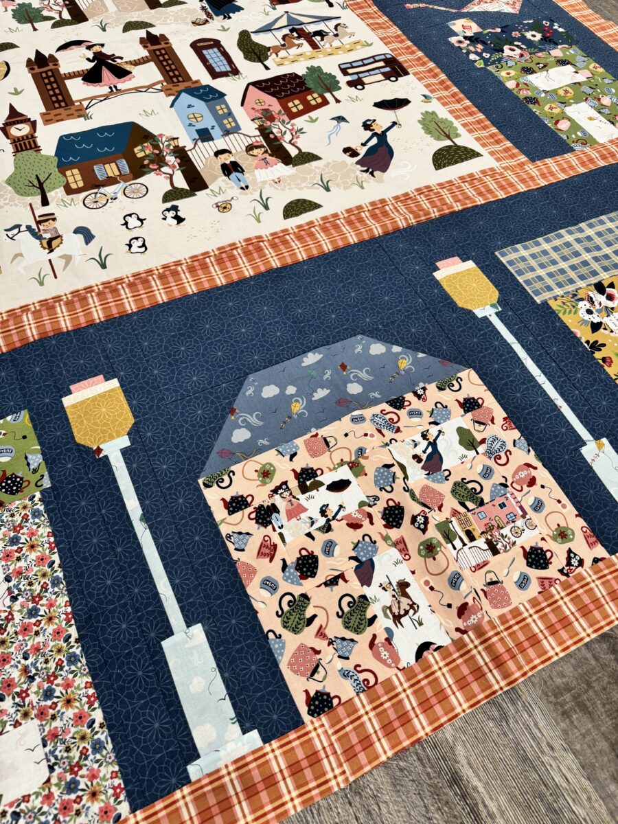 Close up of house quilt block showing corrected piece size to fit quilt row properly