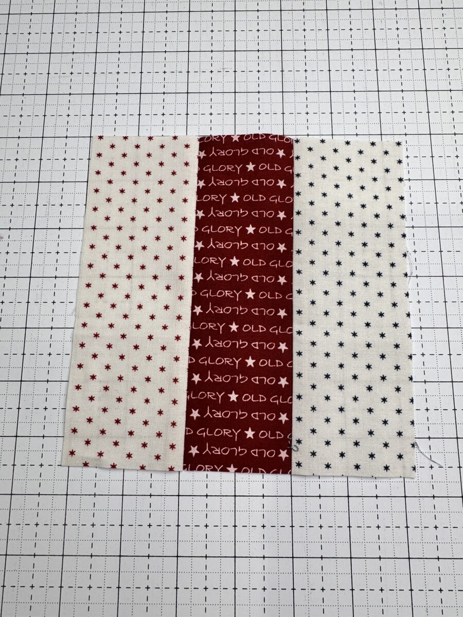 fabric strips sewn together to create a strip set for a rail fence quilt block