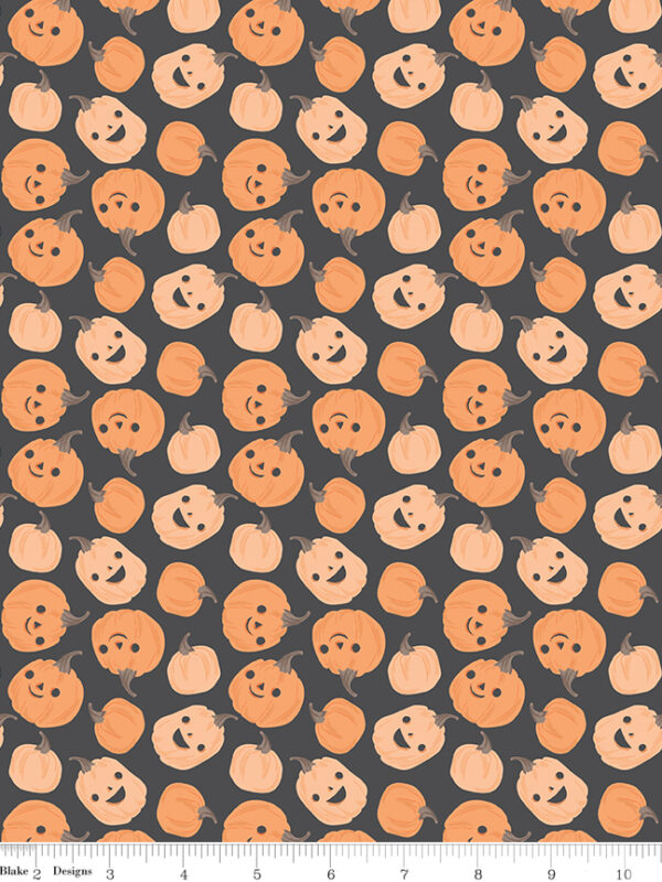 Frank and Friends Pumpkins Charcoal fabric with smiling pumpkins on dark background