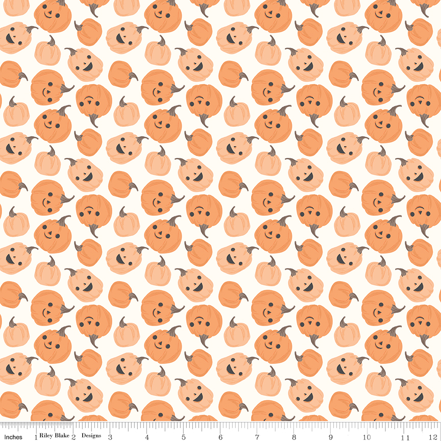 Frank and Friends Pumpkins Cloud fabric with smiling pumpkins on light background