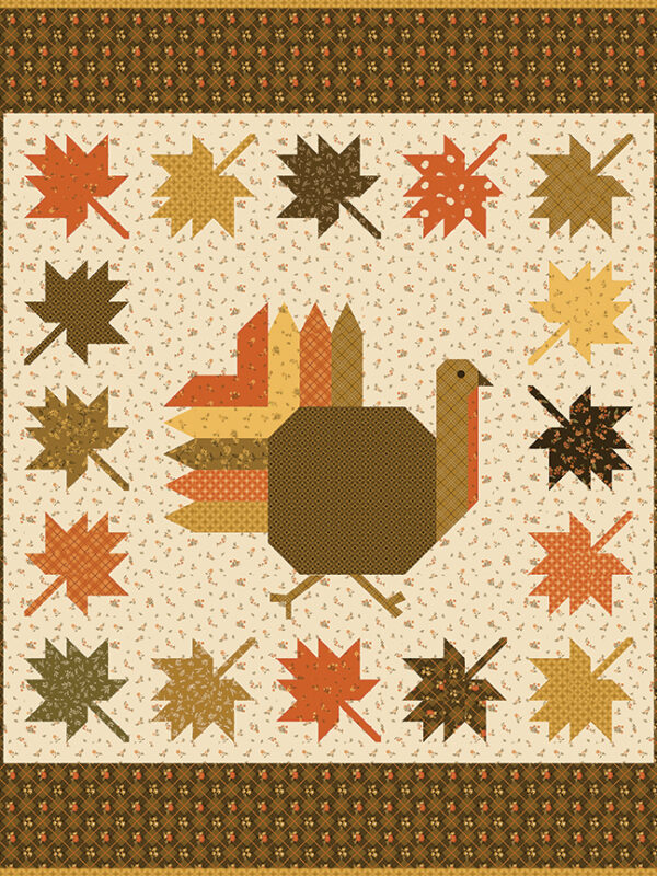 Autumn Hues quilt kit with turkey and fall leaves design