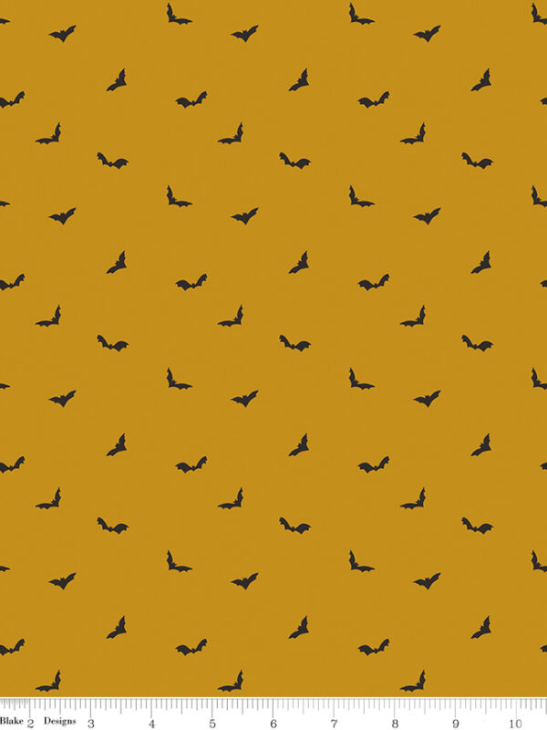 Apothecary Batwings Gold fabric with silhouetted bats in flight