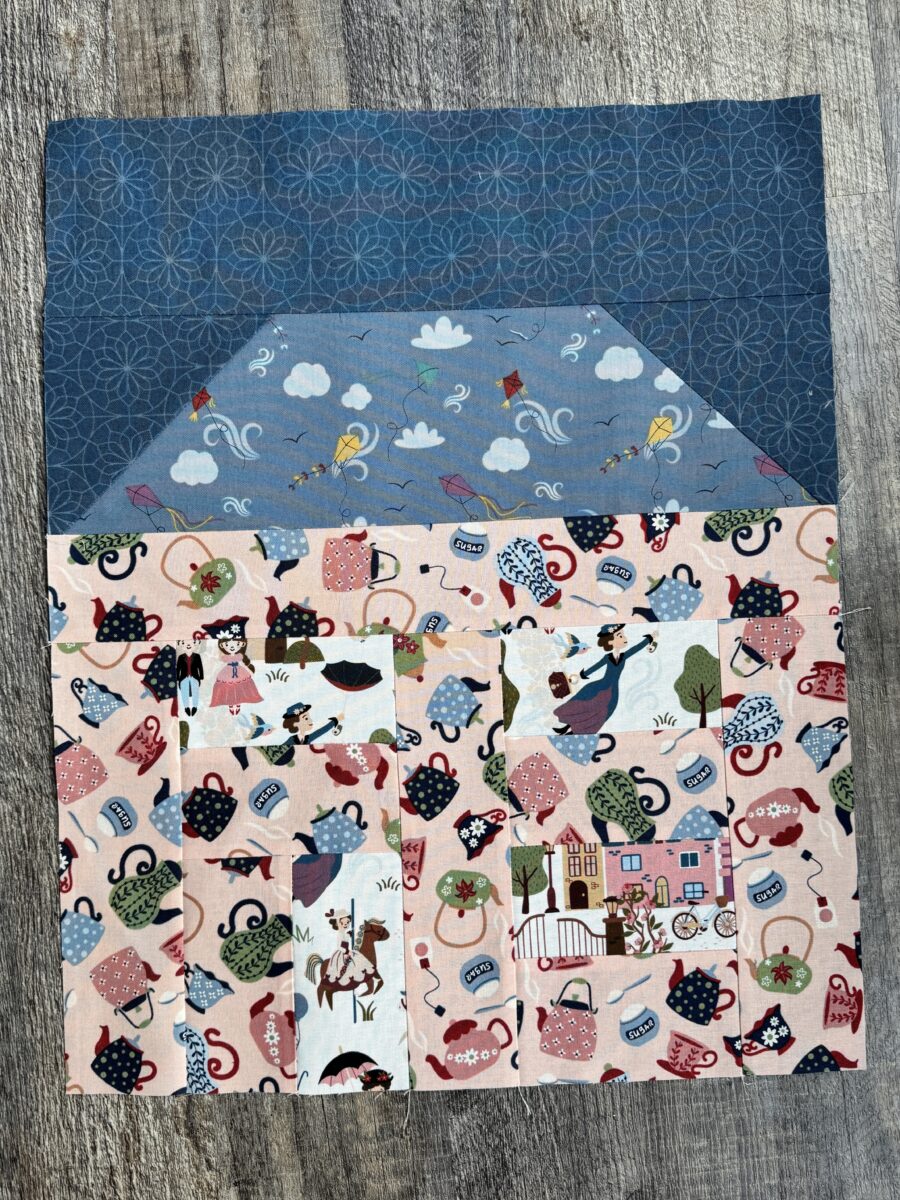 Second house quilt block with different fabric combination and fussy cut details