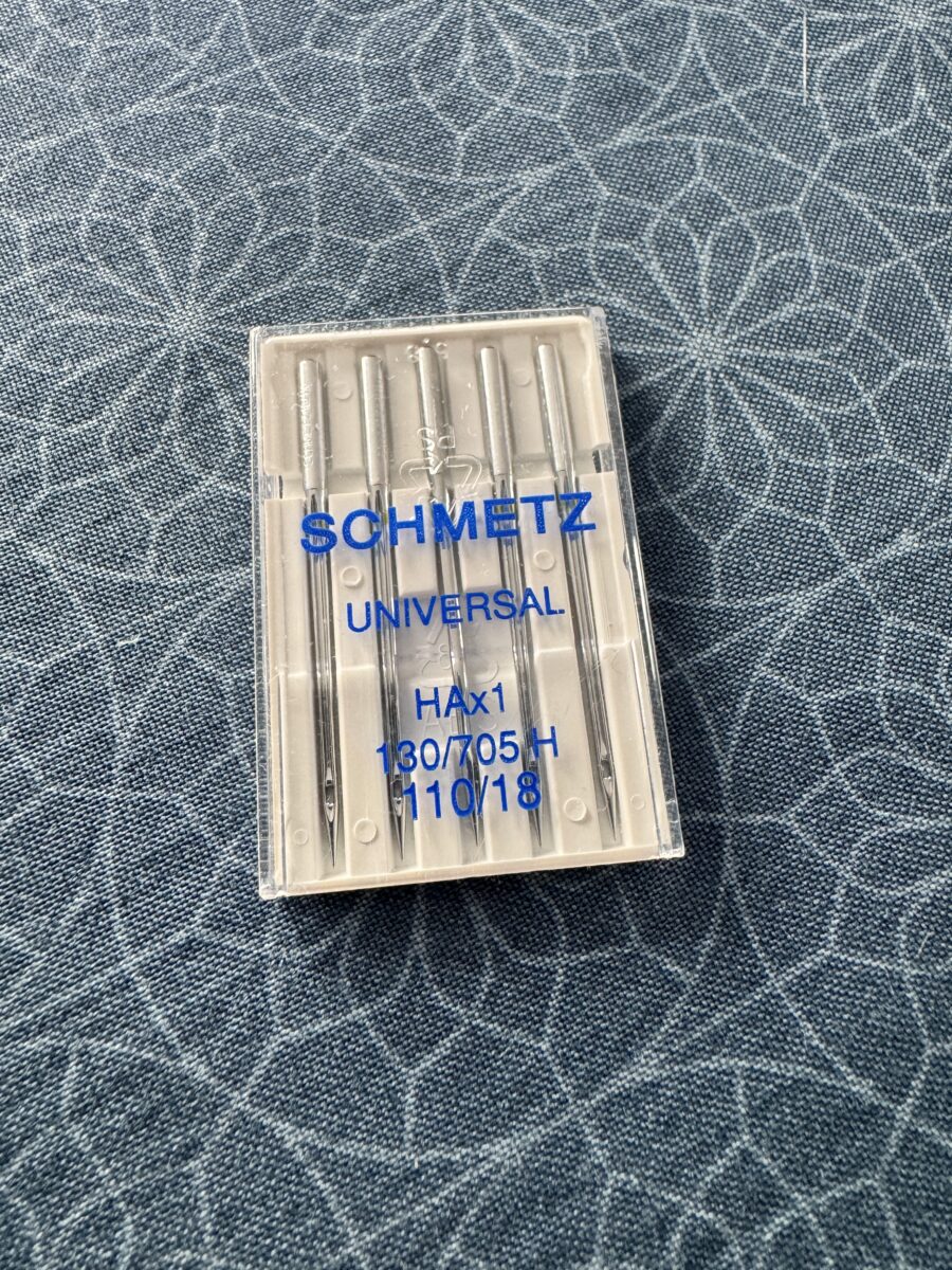 Close-up of Schmetz size 110 sewing machine needles used for thick fabrics and bag making
