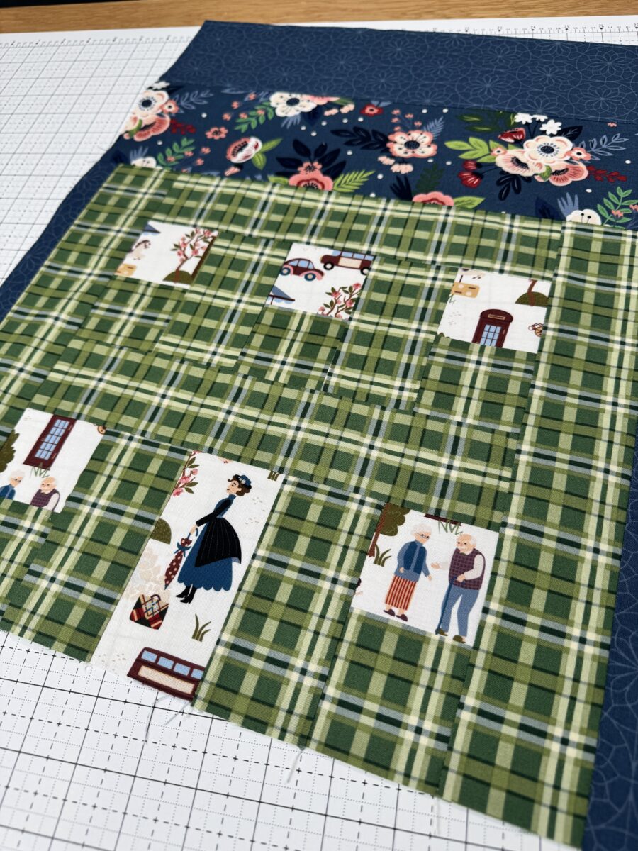 Mary Poppins fussy cut in doorway of green plaid house quilt block
