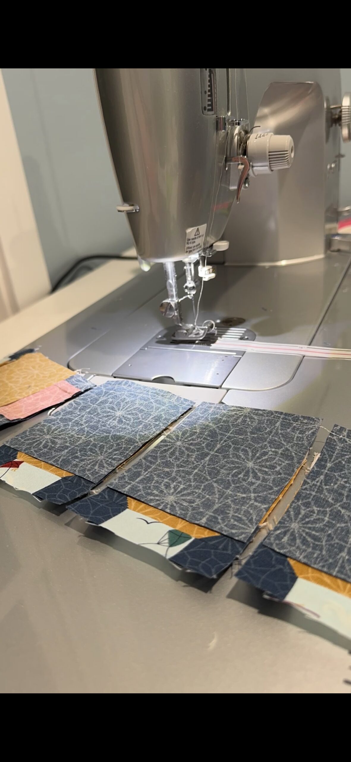Chain pieced fabric units for lamppost quilt blocks during Cherry Tree Lane Quilt Along Week 1