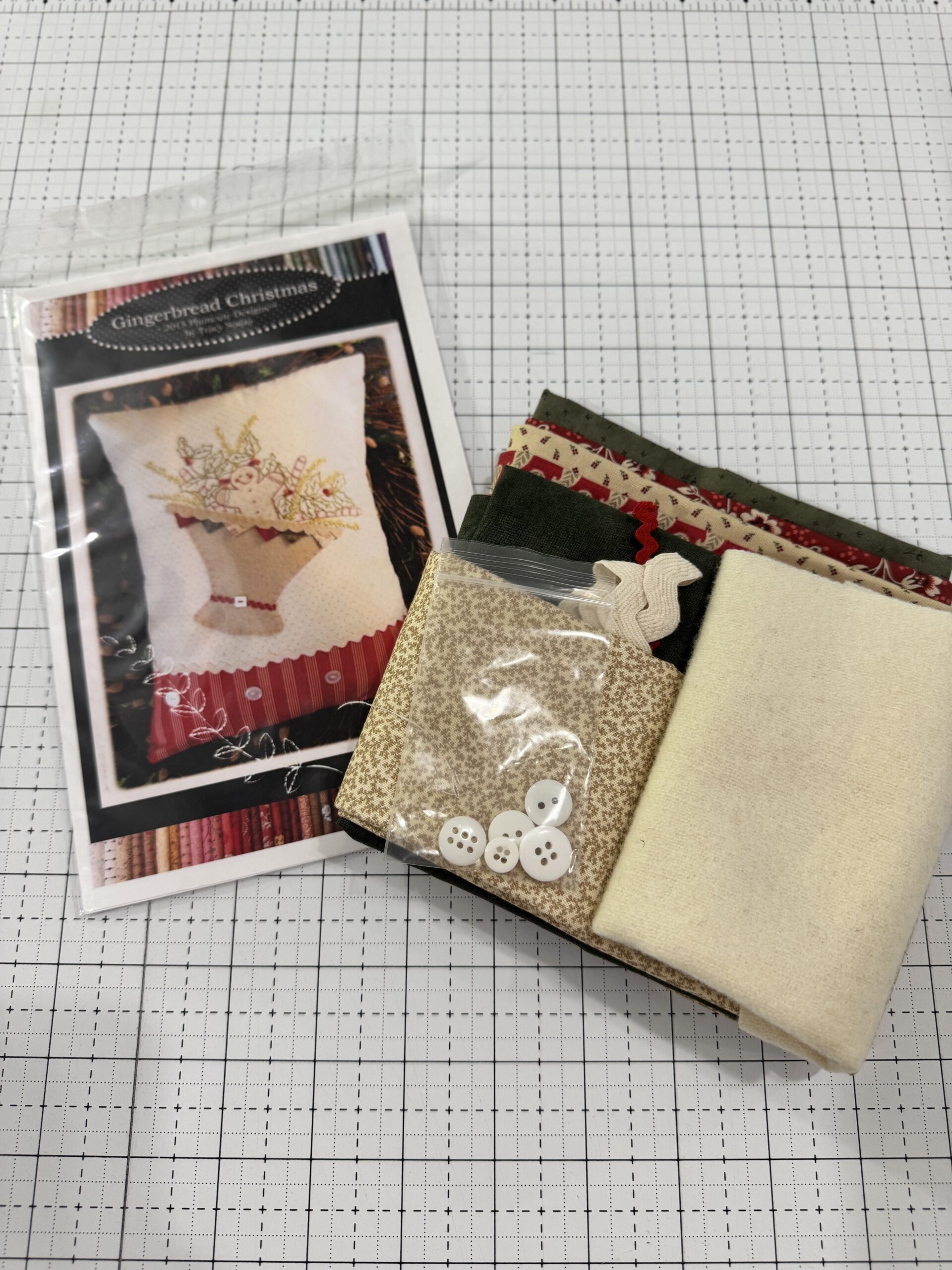 Gingerbread Christmas embroidery pillow kit by Plumcute with fabrics trim and embellishments