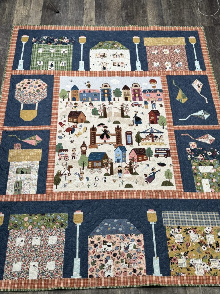 Finished Cherry Tree Lane quilt featuring Mary Poppins fabric and storybook panel design