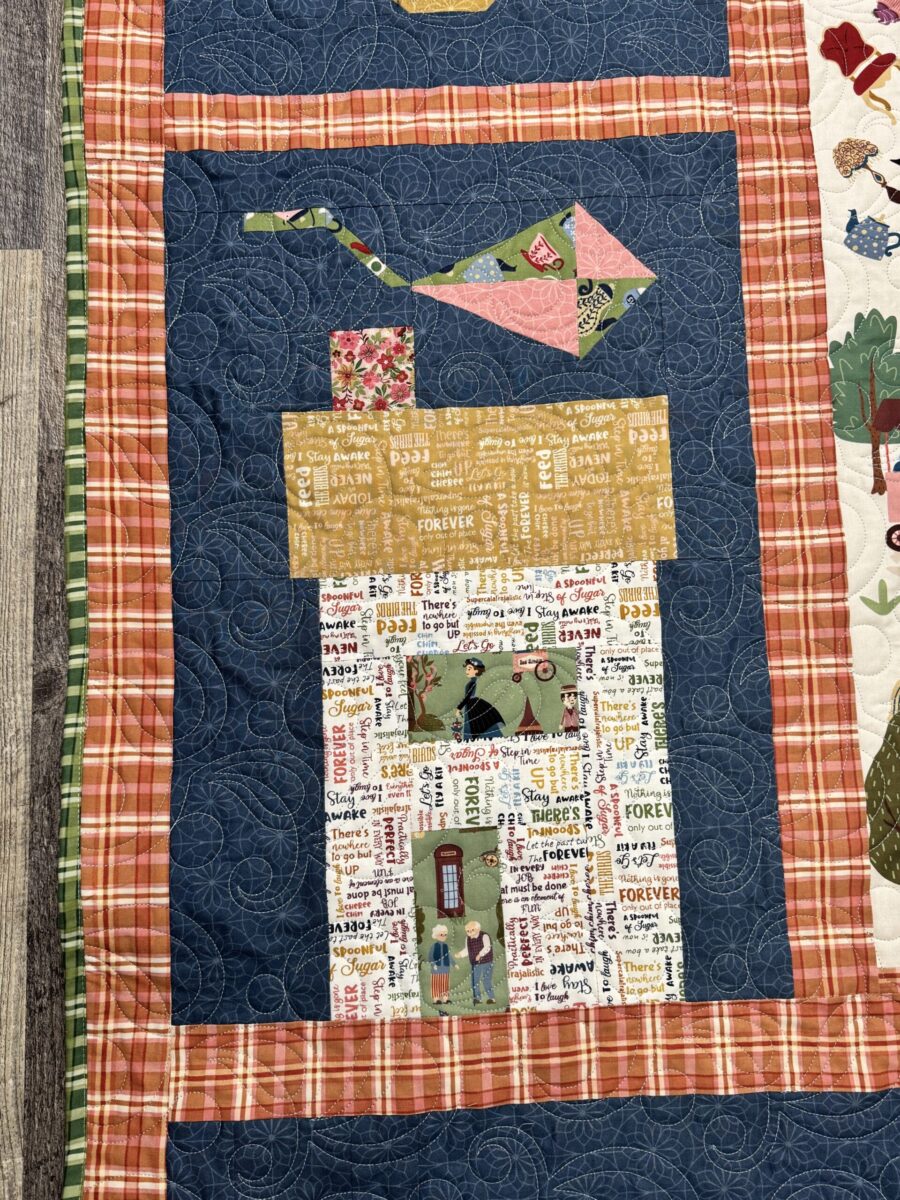 Angled view of house quilt blocks in finished Cherry Tree Lane quilt with fussy cut details