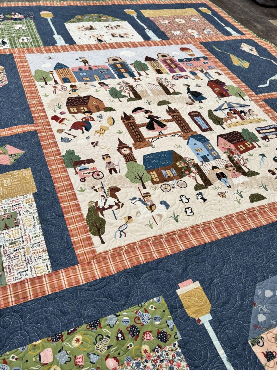 Close up of quilting detail using Freshwater Pearl pantograph on finished quilt