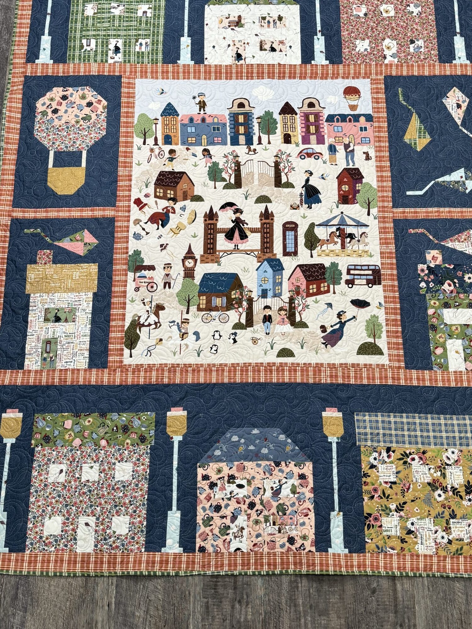 Finished Cherry Tree Lane quilt featuring Mary Poppins fabric and storybook panel design