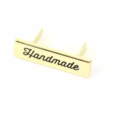 Sallie Tomato script handmade label gold bag hardware
