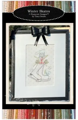 Winter Skates embroidery pattern by Plumcute Designs featuring skates with greenery and snowflake buttons