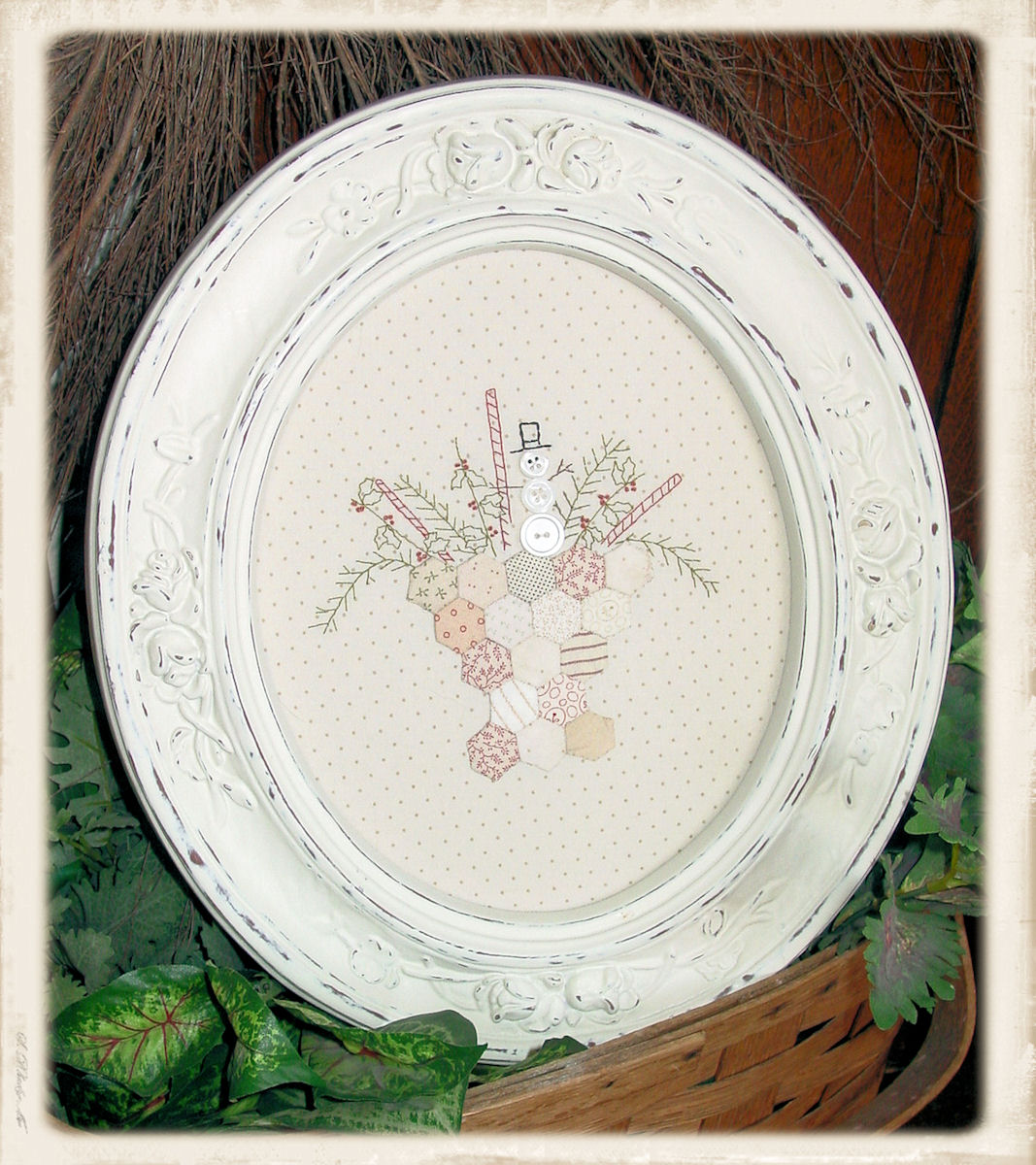 A Winter’s Stitch embroidery pattern by Plumcute Designs featuring snowman with paper pieced hexagons and stitchery