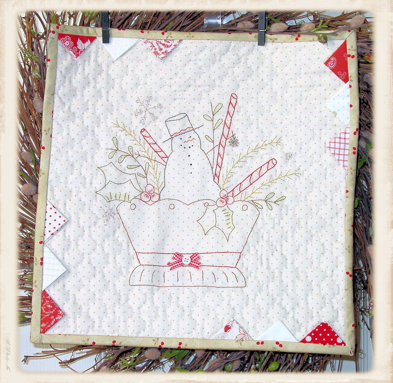 Christmas Basket mini quilt pattern by Plumcute Designs featuring embroidery, prairie points, and snowflake charm