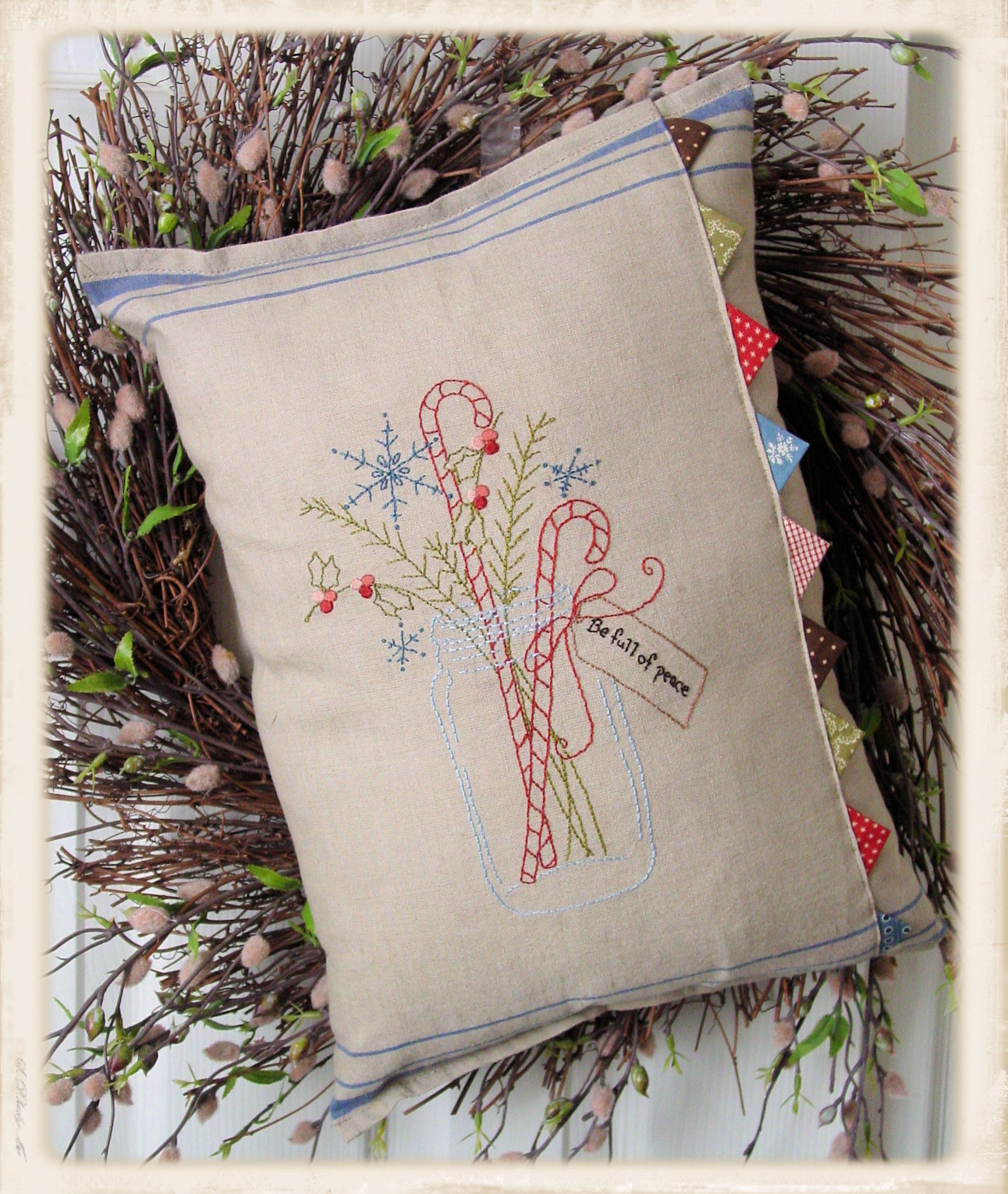 Be Full of Peace pillow pattern by Plumcute Designs featuring embroidery and prairie point details