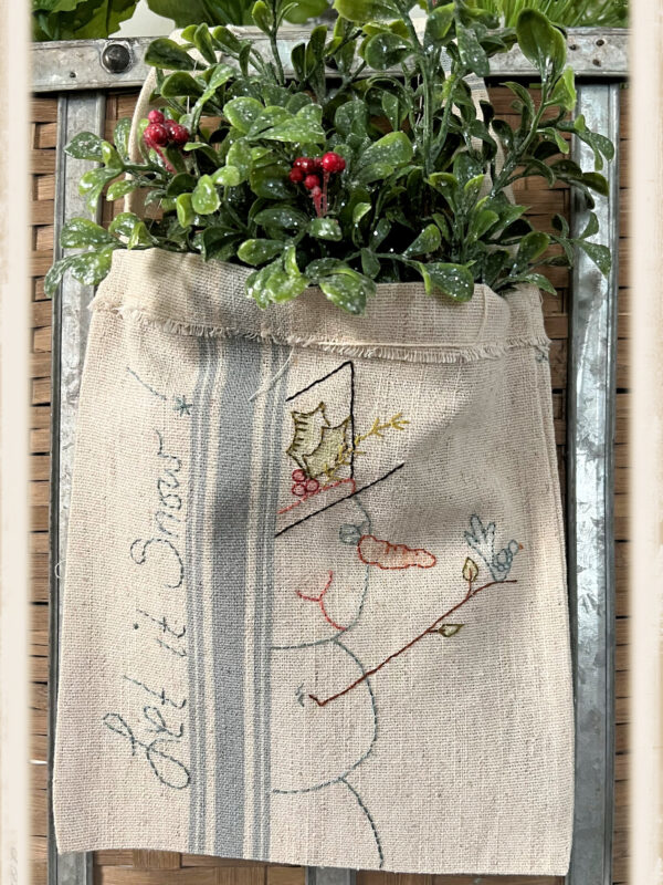 Let It Snow door hanger embroidery kit by Plumcute Designs featuring snowman stitchery on toweling bag