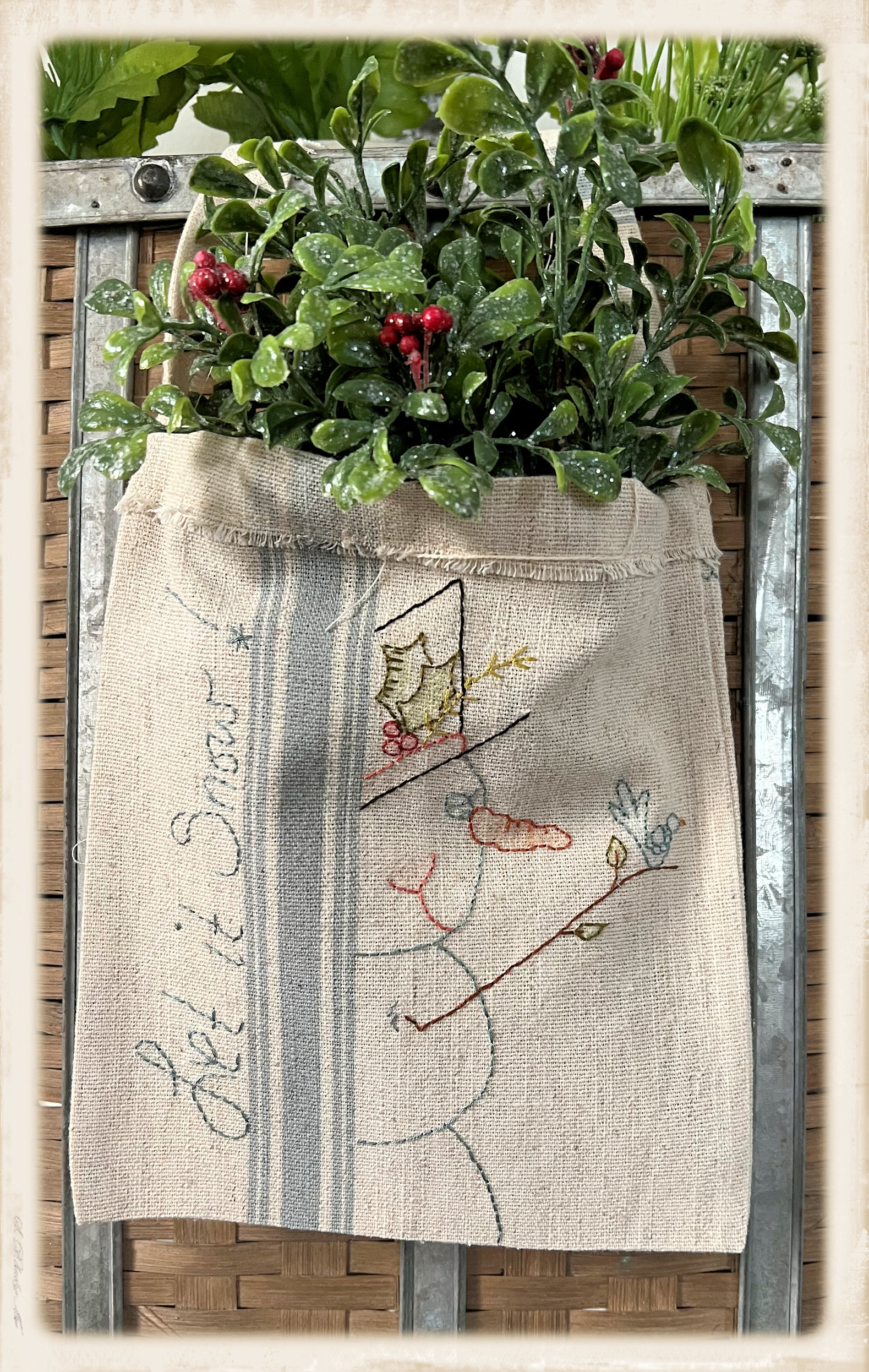 Let It Snow door hanger embroidery kit by Plumcute Designs featuring snowman stitchery on toweling bag