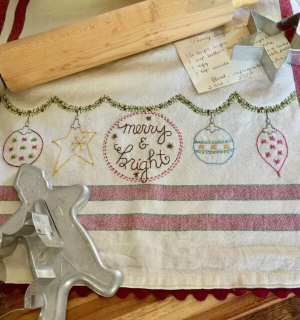 Merry & Bright dishtowel embroidery kit by Bareroots featuring Christmas garland design with towel and supplies