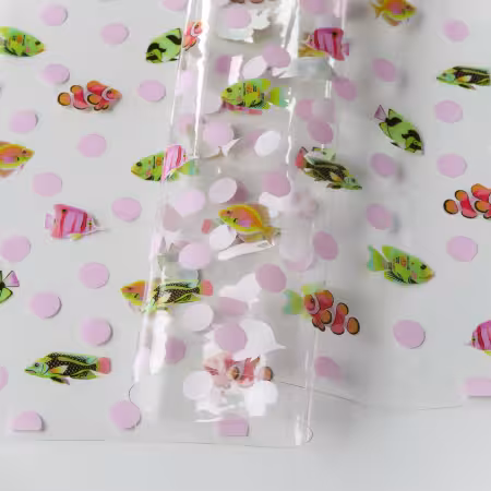 Tula Pink Floral Reef School Crossing TPU Vinyl 1/2 Yard Cut Tula Pink Floral Reef Collection School Crossing TPU vinyl featuring colorful schools of fish swimming across the print
