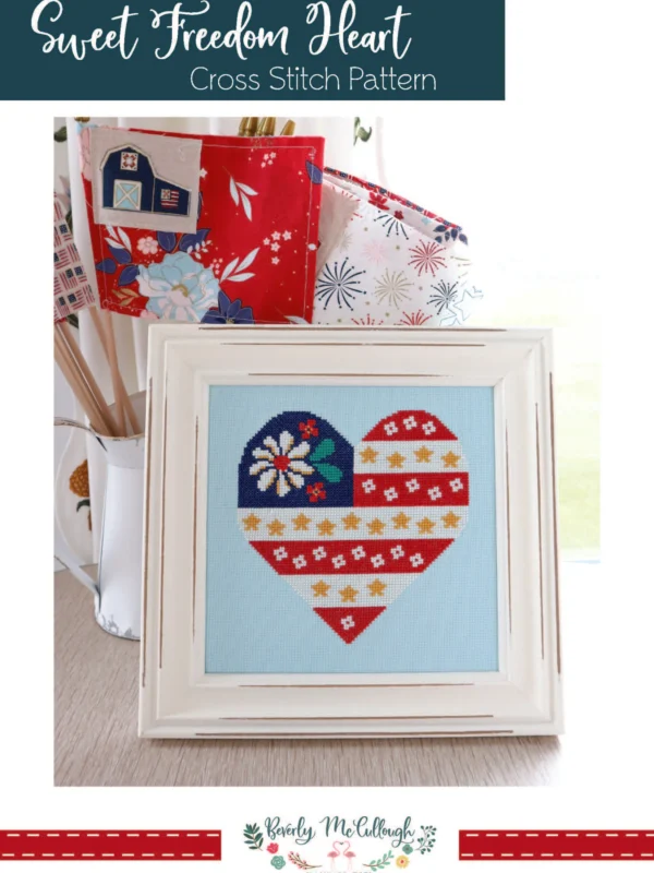 Sweet Freedom Heart Flag patriotic cross stitch pattern stitched on aqua blue fabric