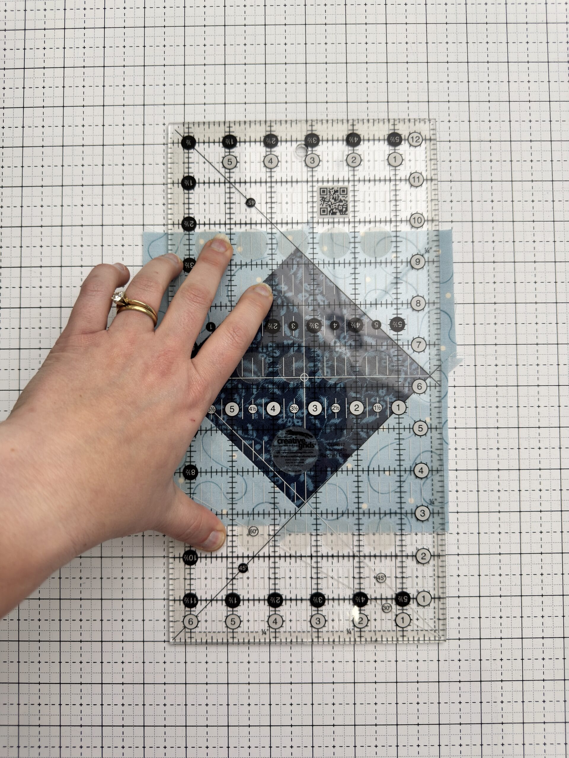 Trimming the first round of Economy Quilt block construction
