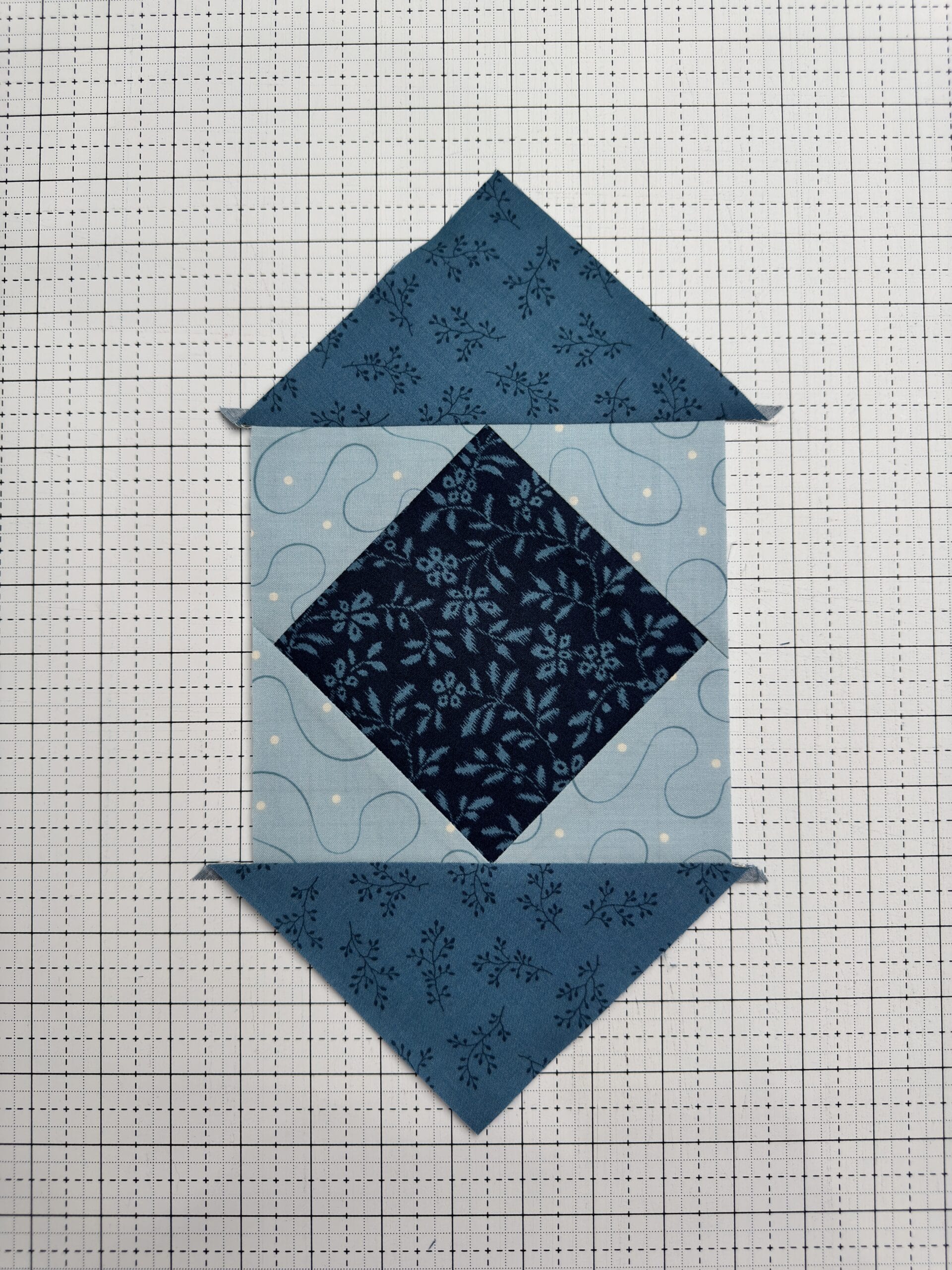 Attaching final layer of triangles to the Economy Quilt Block