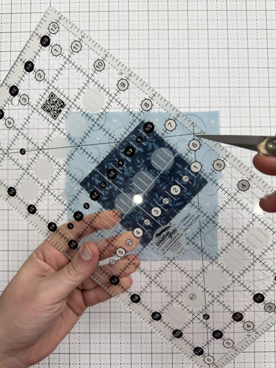 Ruler with bisecting 45 degree lines at the 1/4" seam allowance mark