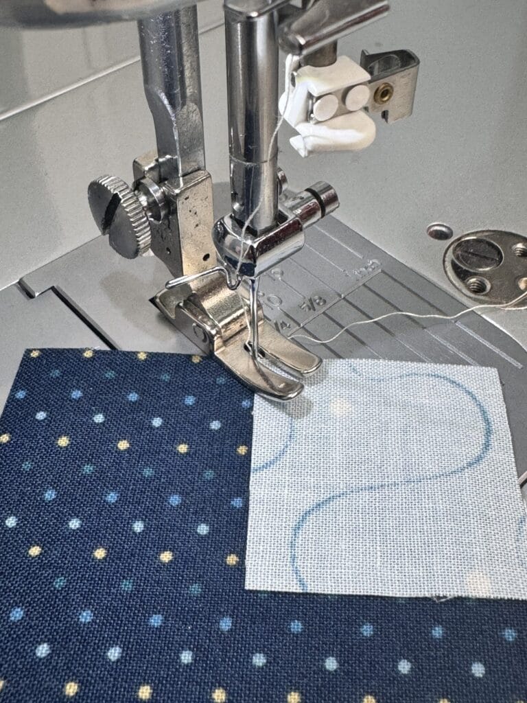 Sewing a corner square on by positioning the needle close to the fabric before starting the seam