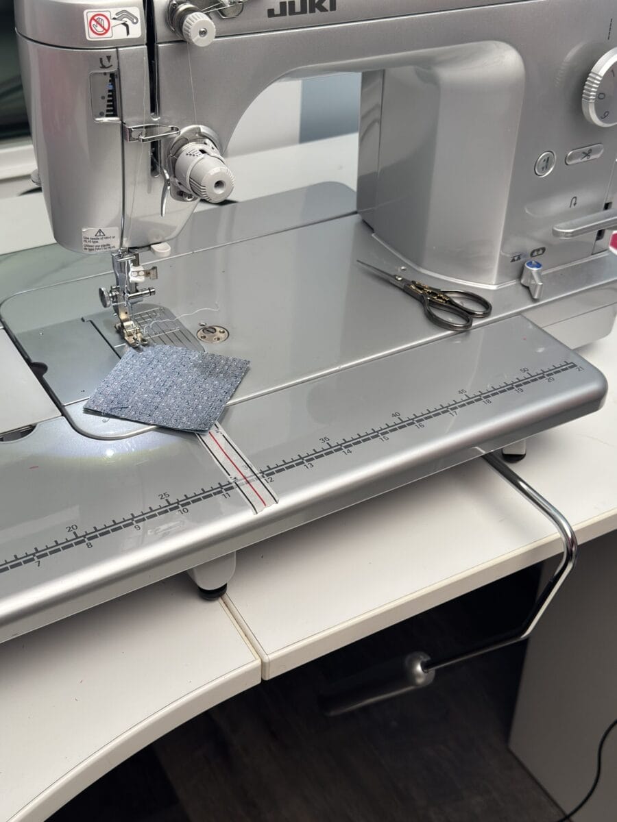 A Sewing machine with a knee lift to reduce presser foot pressure