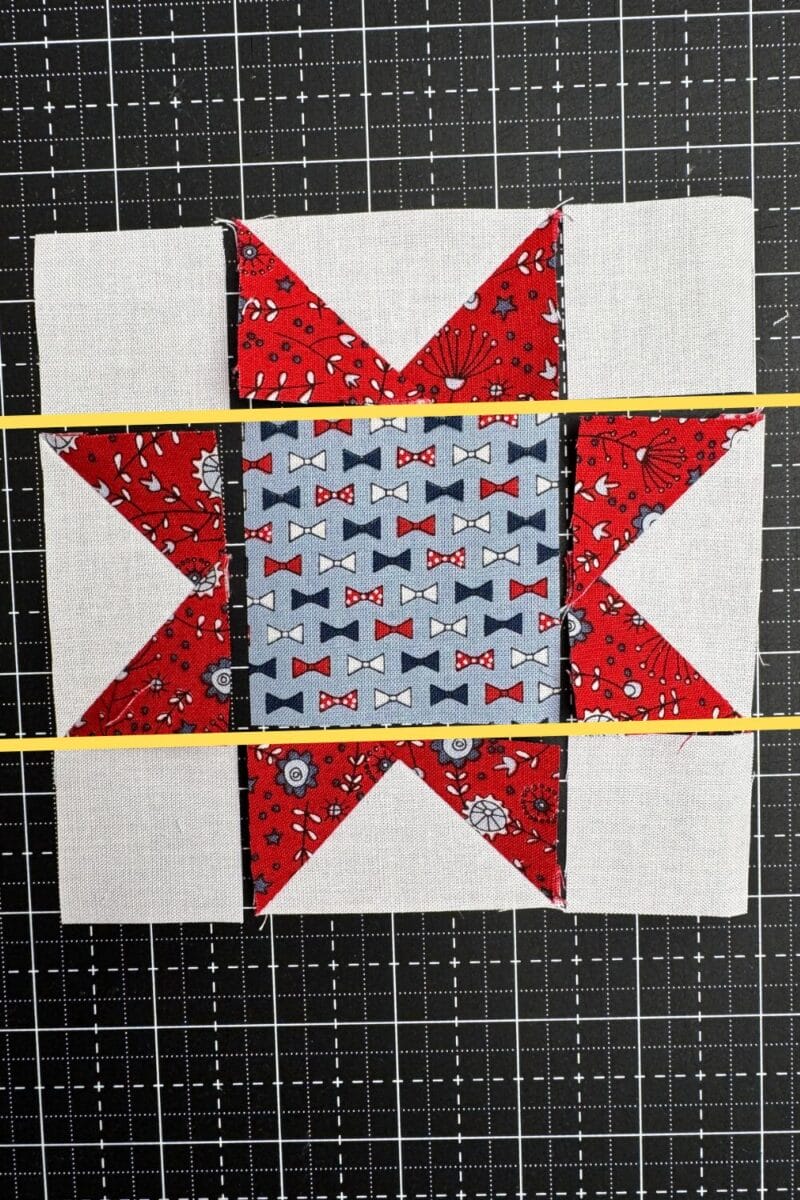 Four corner squares, four flying geese, and a center square arranged in a sawtooth star layout with lines to show where the rows are