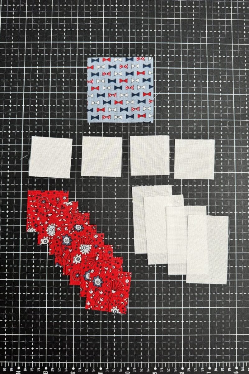 Fabric Pieces in rectangles and squares to make a sawtooth star quilt block