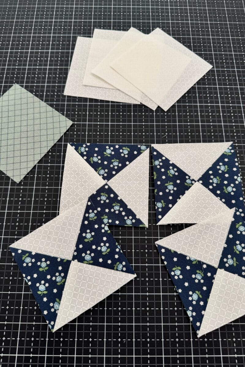 Ohio Star quilt block units including the center and corner squares and the completed hourglass units.  