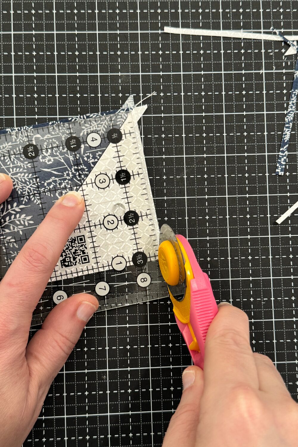 Trimming half square triangles to the exact size.  