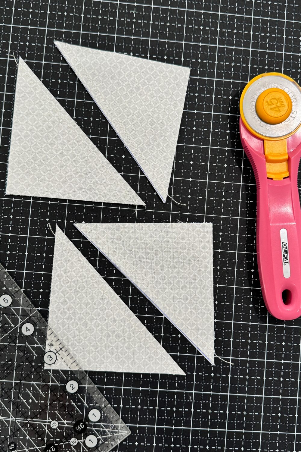 Two square units cut on the diagonal line leaving the sewn line on each side to make a total of four half square triangles. 