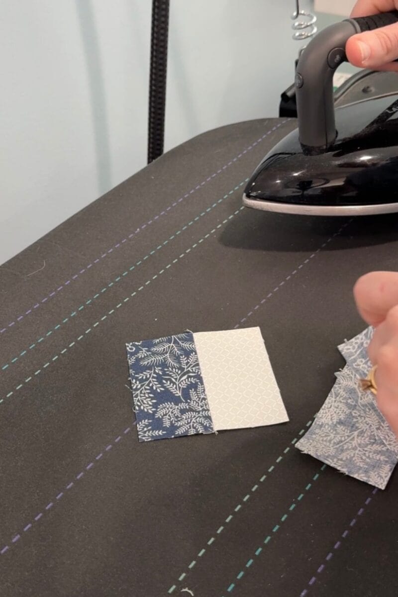 Pressing rectangle units to make center squares for the churn dash quilt block