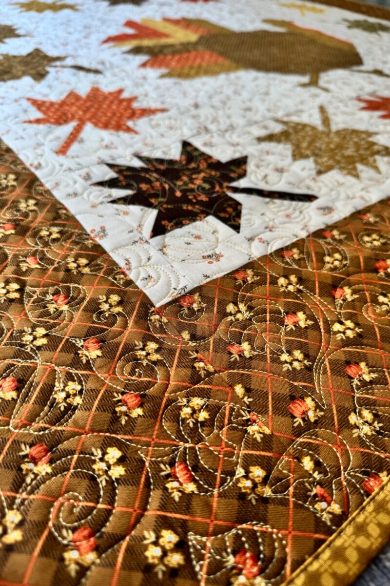 Pieced fall leaves and border on the Autumn Hues quilt