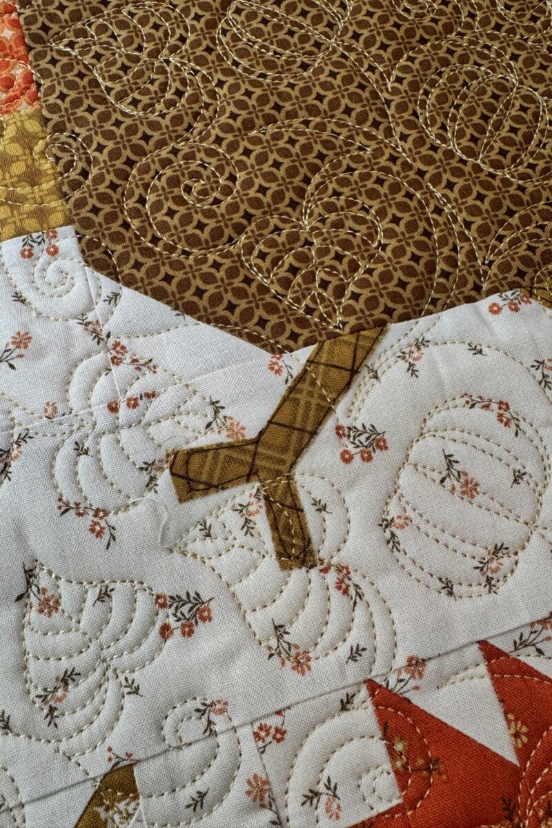 Raw edge appliqué turkey legs on the Autumn Hues quilt
