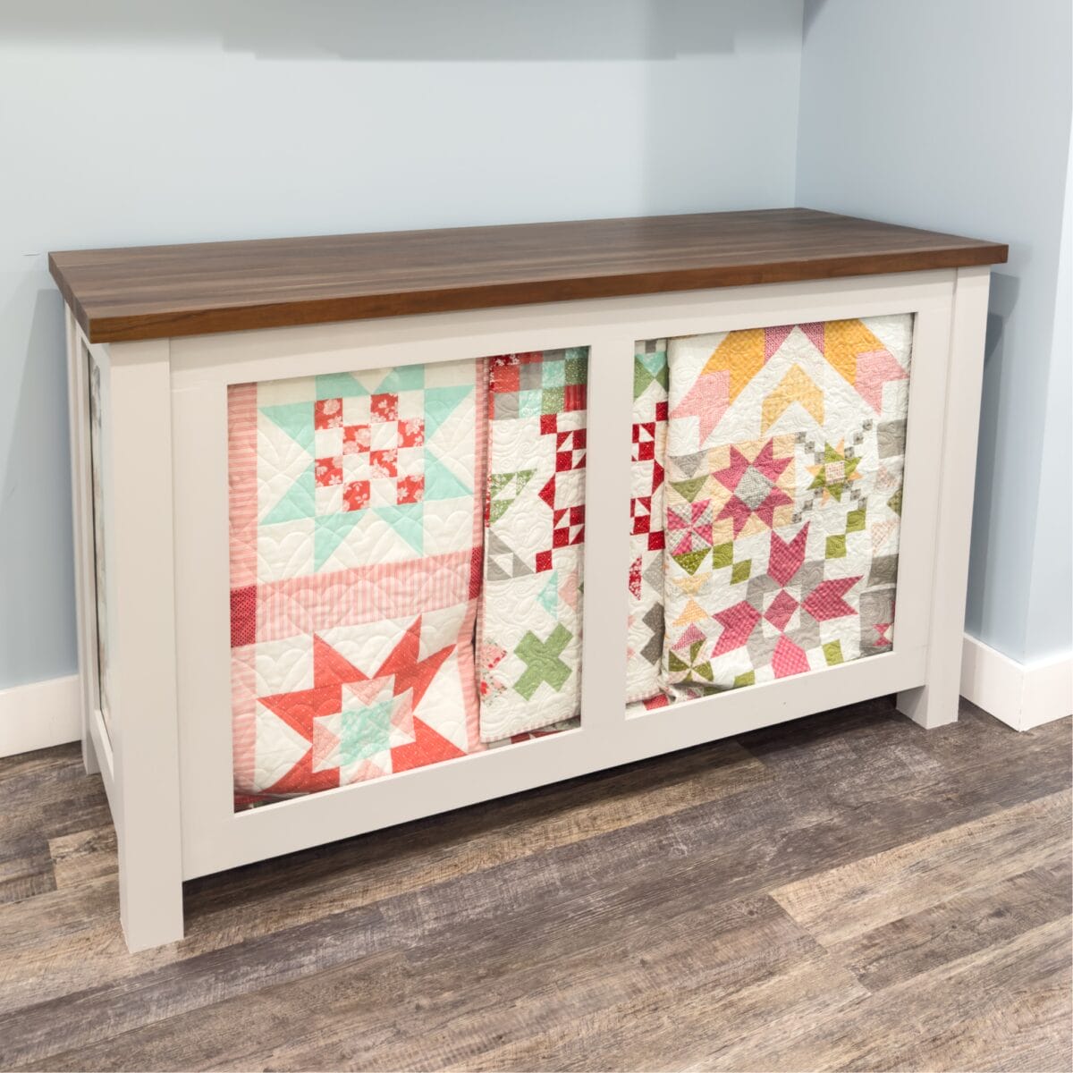 A glass front Quilt Cabinet to display multiple completed quilts.